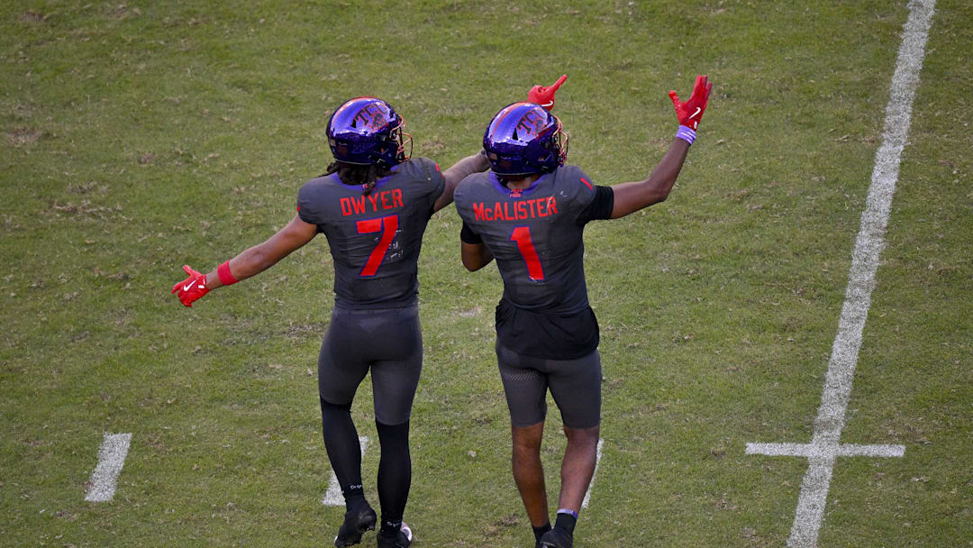 Nov 8, 2025; Fort Worth, Texas, USA; TCU Horned Frogs wide receiver Jordan Dwyer (7) and wide receiver Eric McAlister (1) point to the replay screen during the second half against the Iowa State Cyclones at Amon G. Carter Stadium. Mandatory Credit: Jerome Miron-Imagn Images
