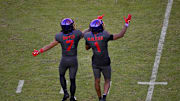 Nov 8, 2025; Fort Worth, Texas, USA; TCU Horned Frogs wide receiver Jordan Dwyer (7) and wide receiver Eric McAlister (1) point to the replay screen during the second half against the Iowa State Cyclones at Amon G. Carter Stadium. Mandatory Credit: Jerome Miron-Imagn Images