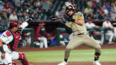 May 3, 2024; Phoenix, Arizona, USA; San Diego Padres outfielder Fernando Tatis Jr. (23) dodges a pitch from Scott McGough