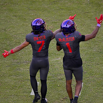 Nov 8, 2025; Fort Worth, Texas, USA; TCU Horned Frogs wide receiver Jordan Dwyer (7) and wide receiver Eric McAlister (1) point to the replay screen during the second half against the Iowa State Cyclones at Amon G. Carter Stadium. Mandatory Credit: Jerome Miron-Imagn Images