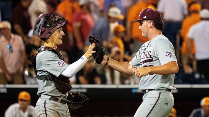 Jun 22, 2024; Omaha, NE, USA; Texas A&M Aggies pitcher Evan Aschenbeck (53) and  catcher Jackson Appel (20) celebrate after defeating the Tennessee Volunteers at Charles Schwab Field Omaha. Mandatory Credit: Dylan Widger-USA TODAY Sports