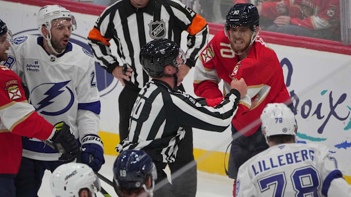 Sep 30, 2024; Sunrise, Florida, USA; Florida Panthers left wing A.J. Greer (10) gets in a scuffle with Tampa Bay Lightning defenseman Emil Lilleberg (78) during the second period at Amerant Bank Arena. Mandatory Credit: Jim Rassol-Imagn Images