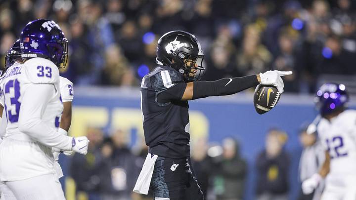 Oct 25, 2025; Morgantown, West Virginia, USA; West Virginia Mountaineers wide receiver Cam Vaughn (4) celebrates a first down after a catch during the third quarter against the Texas Christian University Horned Frogs at Milan Puskar Stadium. Mandatory Credit: Ben Queen-Imagn Images