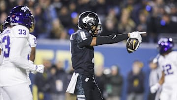 Oct 25, 2025; Morgantown, West Virginia, USA; West Virginia Mountaineers wide receiver Cam Vaughn (4) celebrates a first down after a catch during the third quarter against the Texas Christian University Horned Frogs at Milan Puskar Stadium. Mandatory Credit: Ben Queen-Imagn Images