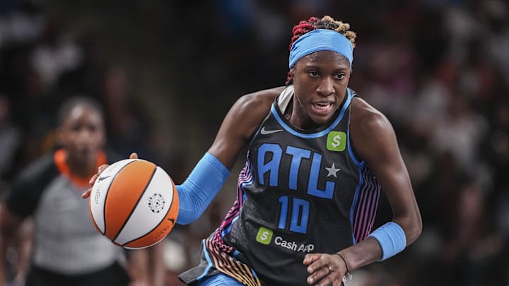 Atlanta Dream guard Rhyne Howard dribbles with the ball.
