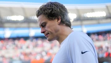 Injured Cincinnati Bengals quarterback Joe Burrow (9) walks onto the field before the first quarter of the NFL Week 12 game between the Cincinnati Bengals and the New England Patriots at Paycor Stadium in downtown Cincinnati on Sunday, Nov. 23, 2025.