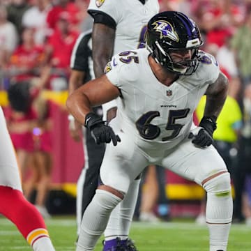 Sep 5, 2024; Kansas City, Missouri, USA; Baltimore Ravens guard Patrick Mekari (65) at the line of scrimmage against the Kansas City Chiefs during the game at GEHA Field at Arrowhead Stadium. Mandatory Credit: Denny Medley-Imagn Images