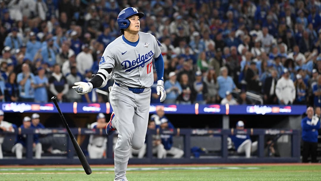 Oct 24, 2025; Toronto, Ontario, CAN; Los Angeles Dodgers designated hitter Shohei Ohtani (17) hits a two-run home run against the Toronto Blue Jays in the seventh inning during game one of the 2025 MLB World Series at Rogers Centre. Mandatory Credit: Dan Hamilton-Imagn Images
