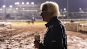 After three years of being away, Baffert takes in the scene of the track early Friday morning before he works his Kentucky Derby horses. 