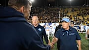 Oct 17, 2025; Berkeley, California, USA; California Golden Bears head coach Justin Wilcox and North Carolina Tar Heels head coach Bill Belichick shake hands after the game at California Memorial Stadium. 