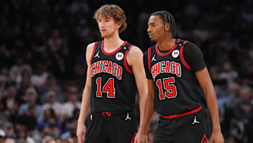 Mar 19, 2025; Phoenix, Arizona, USA; Chicago Bulls forward Matas Buzelis (14) and Chicago Bulls forward Julian Phillips (15) look on against the Phoenix Suns during the first half at PHX Aena. Mandatory Credit: Joe Camporeale-Imagn Images