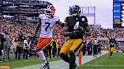 Oct 12, 2025; Pittsburgh, Pennsylvania, USA; Pittsburgh Steelers wide receiver DK Metcalf (4) makes a catch for a touchdown during the fourth quarter at Acrisure Stadium. Mandatory Credit: Barry Reeger-Imagn Images