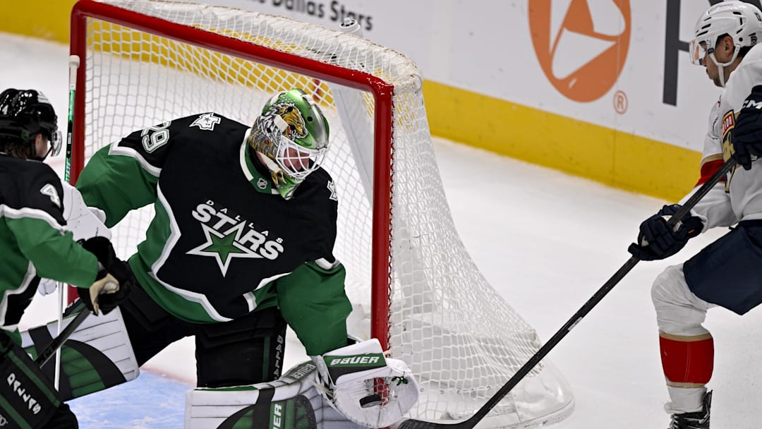 Dec 13, 2025; Dallas, Texas, USA; Dallas Stars goaltender Jake Oettinger (29) stops a shot by Florida Panthers center Sam Reinhart (13) during the first period at the American Airlines Center. Mandatory Credit: Jerome Miron-Imagn Images