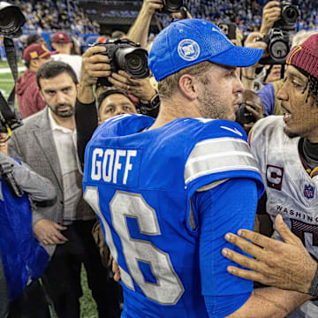 Jared Goff congratulates Jayden Daniels after the Lions upset loss to the Commanders