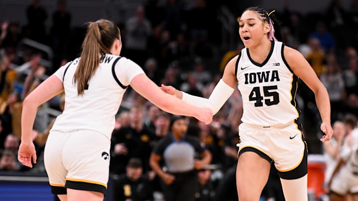 Mar 7, 2026; Indianapolis, IN, USA; Iowa Hawkeyes guard Taylor Stremlow (1) and Iowa Hawkeyes forward Hannah Stuelke (45) celebrate after a play against the Michigan Wolverines during the second half at Gainbridge Fieldhouse. Mandatory Credit: Robert Goddin-Imagn Images