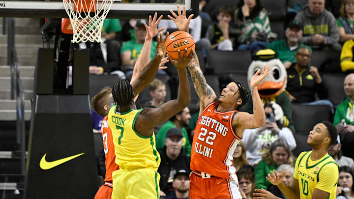 Jan 2, 2025; Eugene, Oregon, USA; Illinois Fighting Illini guard Tre White (22) and center Tomislav Ivisic (13) defend a shot by Oregon Ducks forward Supreme Cook (7) during the second half at Matthew Knight Arena. Mandatory Credit: Craig Strobeck-Imagn Images Jan 2, 2025; Eugene, Oregon, USA; Illinois Fighting Illini guard Tre White (22) and center Tomislav Ivisic (13) defend a shot by Oregon Ducks forward Supreme Cook (7) during the second half at Matthew Knight Arena. Mandatory Credit: Craig Strobeck-Imagn Images