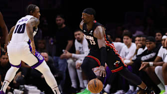 Nov 4, 2024; Miami, Florida, USA; Miami Heat center Bam Adebayo (13) drives to the basket against Sacramento Kings forward DeMar DeRozan (10) during the second quarter at Kaseya Center. Mandatory Credit: Sam Navarro-Imagn Images