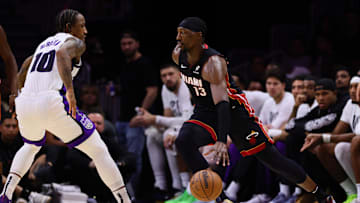 Nov 4, 2024; Miami, Florida, USA; Miami Heat center Bam Adebayo (13) drives to the basket against Sacramento Kings forward DeMar DeRozan (10) during the second quarter at Kaseya Center. Mandatory Credit: Sam Navarro-Imagn Images