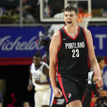 Jul 15, 2024; Las Vegas, NV, USA; Portland Trail Blazers center Donovan Clingan (23) reacts to a play against the Philadelphia 76ers during the second half at Thomas & Mack Center. Mandatory Credit: Lucas Peltier-Imagn Images