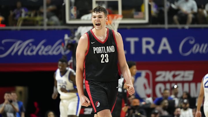 Jul 15, 2024; Las Vegas, NV, USA; Portland Trail Blazers center Donovan Clingan (23) reacts to a play against the Philadelphia 76ers during the second half at Thomas & Mack Center. Mandatory Credit: Lucas Peltier-Imagn Images