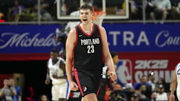Jul 15, 2024; Las Vegas, NV, USA; Portland Trail Blazers center Donovan Clingan (23) reacts to a play against the Philadelphia 76ers during the second half at Thomas & Mack Center. Mandatory Credit: Lucas Peltier-Imagn Images