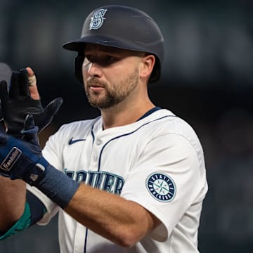 Seattle Mariners catcher Cal Raleigh celebrates after hitting an RBI single during a game against the San Diego Padres on Wednesday at T-Mobile Park.