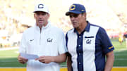 Sep 6, 2025; Berkeley, California, USA; California Golden Bears head coach Justin Wilcox (left) and general manager Ron Rivera (right) talk after defeating the Texas Southern Tigers at California Memorial Stadium. Mandatory Credit: Darren Yamashita-Imagn Images