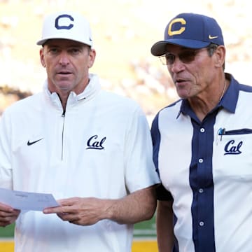 Coach Justin Wilcox (left) and general manager Ron Rivera visit at California Memorial Stadium. 