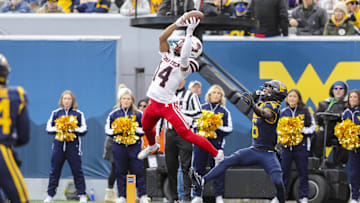 Nov 29, 2025; Morgantown, West Virginia, USA; Texas Tech Red Raiders wide receiver Micah Hudson (14) makes a catch for a touchdown during the third quarter against the West Virginia Mountaineers at Milan Puskar Stadium. Mandatory Credit: Ben Queen-Imagn Images