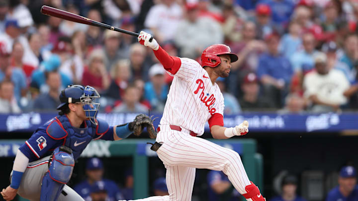Mar 26, 2026; Philadelphia, Pennsylvania, USA; Philadelphia Phillies center fielder Justin Crawford (2) hits a single during the fifth inning against the Texas Rangers at Citizens Bank Park. Mandatory Credit: Bill Streicher-Imagn Images