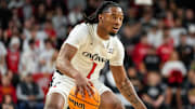 Cincinnati Bearcats guard Day Day Thomas (1) drives in the first half of the NCAA basketball game between the Cincinnati Bearcats and the West Virginia Mountaineers at Fifth Third Arena in Cincinnati on Sunday, Feb. 2, 2025.