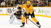 Jan 16, 2025; Nashville, Tennessee, USA;  Nashville Predators center Ryan O'Reilly (90) skates with the puck against the Chicago Blackhawks during the first period at Bridgestone Arena. Mandatory Credit: Steve Roberts-Imagn Images