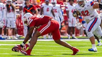 Cornhuskers defensive lineman Williams Nwaneri scoops up the ball before scoring on a 29-yard fumble return