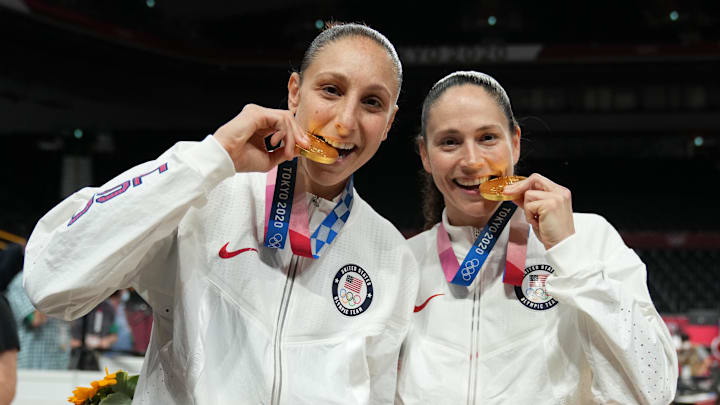 Aug 8, 2021; Saitama, Japan; United States players Diana Taurasi and Sue Bird celebrate with their gold medals after the women's basketball gold medal match during the Tokyo 2020 Olympic Summer Games at Saitama Super Arena. Mandatory Credit: Kyle Terada-Imagn Images Aug 8, 2021; Saitama, Japan; United States players Diana Taurasi and Sue Bird celebrate with their gold medals after the women's basketball gold medal match during the Tokyo 2020 Olympic Summer Games at Saitama Super Arena. Mandatory Credit: Kyle Terada-Imagn Images