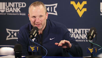 Mar 8, 2025; Morgantown, West Virginia, USA; West Virginia Mountaineers head coach Darian DeVries answers questions from the media after defeating the UCF Knights at WVU Coliseum. Mandatory Credit: Ben Queen-Imagn Images