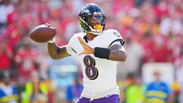 Sep 28, 2025; Kansas City, Missouri, USA; Baltimore Ravens quarterback Lamar Jackson (8) throws a pass during the first half against the Kansas City Chiefs at GEHA Field at Arrowhead Stadium. Mandatory Credit: Jay Biggerstaff-Imagn Images