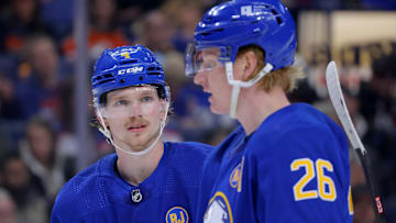 Mar 9, 2024; Buffalo, New York, USA;  Buffalo Sabres defenseman Bowen Byram (4) interacts with defenseman Rasmus Dahlin (26) during a stoppage in play against the Edmonton Oilers in the third period at KeyBank Center. Mandatory Credit: Timothy T. Ludwig-Imagn Images