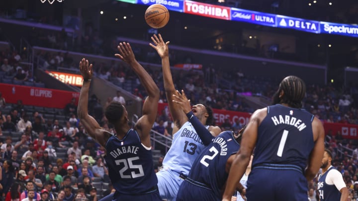 Nov 12, 2023; Los Angeles, California, USA; Memphis Grizzlies forward Jaren Jackson Jr. (13) draws an offensive foul against LA Clippers forward Moussa Diabate (25) during the quarter of a game at Crypto.com Arena. 