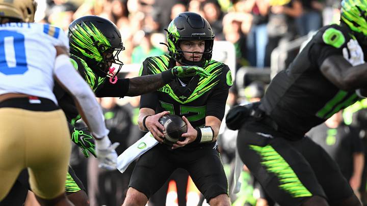 Oct 10, 2026; Eugene, Oregon, USA;  Oregon Ducks quarterback Brock Thomas (12) makes a pass during the fourth quarter against the UCLA Bruins at Autzen Stadium.  Mandatory Credit: Troy Wayrynen-Imagn Images