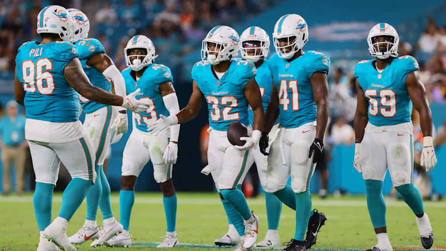 Miami Dolphins safety Patrick McMorris (32) celebrates with teammates after recovering a fumble against the Washington Commanders during the fourth quarter of a preseason game at Hard Rock Stadium.  | Sam Navarro-Imagn Images