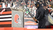 Cleveland Browns running back Nick Chubb breaks guitar painted in New York Jets colors and logos before the game between the Browns and the Jets at Cleveland Browns Stadium. 