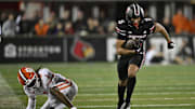 Nov 14, 2025; Louisville, Kentucky, USA;  Louisville Cardinals wide receiver Antonio Meeks (15) runs the ball against Clemson Tigers cornerback Branden Strozier (1) during the second half at L&N Federal Credit Union Stadium. Clemson defeated Louisville 20-19. Mandatory Credit: Jamie Rhodes-Imagn Images