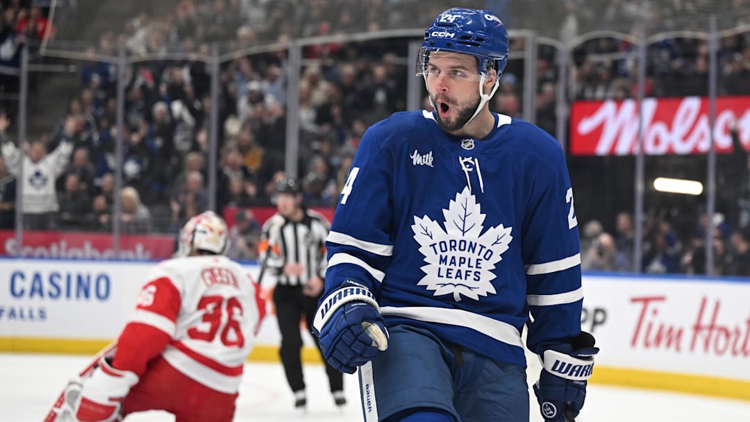 Jan 21, 2026; Toronto, Ontario, CAN;  Toronto Maple Leafs forward Scott Laughton (24) celebrates after scoring a goal against Detroit Red Wings goalie John Gibson (36) in the first period at Scotiabank Arena. Mandatory Credit: Dan Hamilton-Imagn Images
