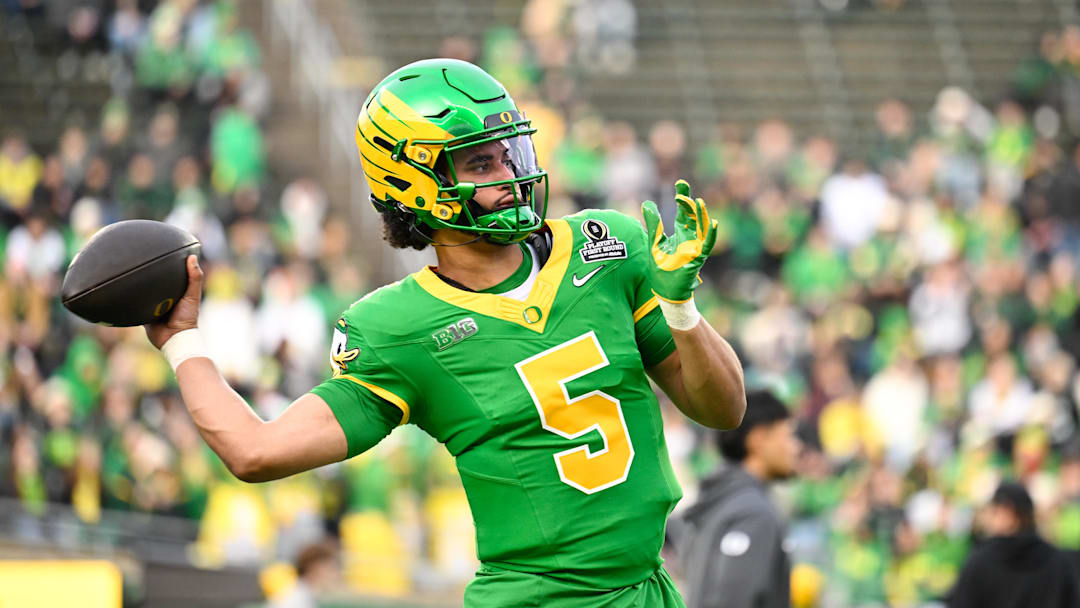 Dec 20, 2025; Eugene, OR, USA; Oregon Ducks quarterback Dante Moore (5) warms up before the game against the James Madison Dukes at Autzen Stadium. Mandatory Credit: Troy Wayrynen-Imagn Images