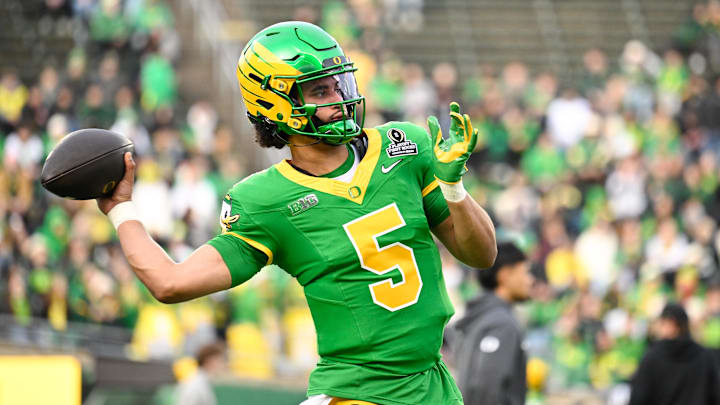 The Oregon Ducks and quarterback Dante Moore are favored in the quarterfinals.
