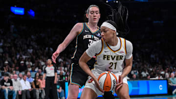 Jul 16, 2025; Brooklyn, New York, USA; Indiana Fever forward Makayla Timpson (21) posts up as New York Liberty forward Breanna Stewart (30) defends during the second half at Barclays Center. Mandatory Credit: John Jones-Imagn Images