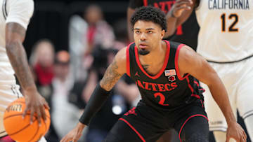 Dec 21, 2024; San Jose, California, USA; San Diego State Aztecs guard Nick Boyd (2) defends against California Golden Bears guard Jovan Blacksher Jr. (left) during the first half at SAP Center. Mandatory Credit: Darren Yamashita-Imagn Images