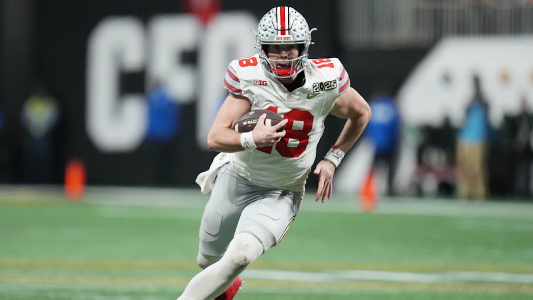 Jan 20, 2025; Atlanta, GA, USA; Ohio State Buckeyes quarterback Will Howard (18) runs the ball against the Notre Dame Fighting Irish in the second half in the CFP National Championship college football game at Mercedes-Benz Stadium. Mandatory Credit: Kirby Lee-Imagn Images