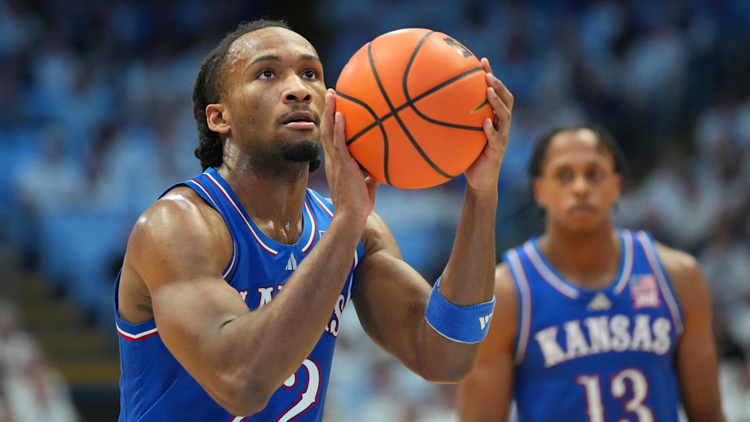 Nov 7, 2025; Chapel Hill, North Carolina, USA;  Kansas Jayhawks guard Darryn Peterson (22) on the line in the first half at Dean E. Smith Center. Mandatory Credit: Bob Donnan-Imagn Images