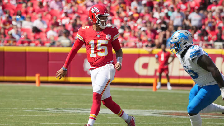 Aug 17, 2024; Kansas City, Missouri, USA; Kansas City Chiefs quarterback Patrick Mahomes (15) throws a behind-the-back underhand pass to tight end Travis Kelce (87) (not pictured) against the Detroit Lions during the first half at GEHA Field at Arrowhead Stadium. Mandatory Credit: Denny Medley-USA TODAY Sports